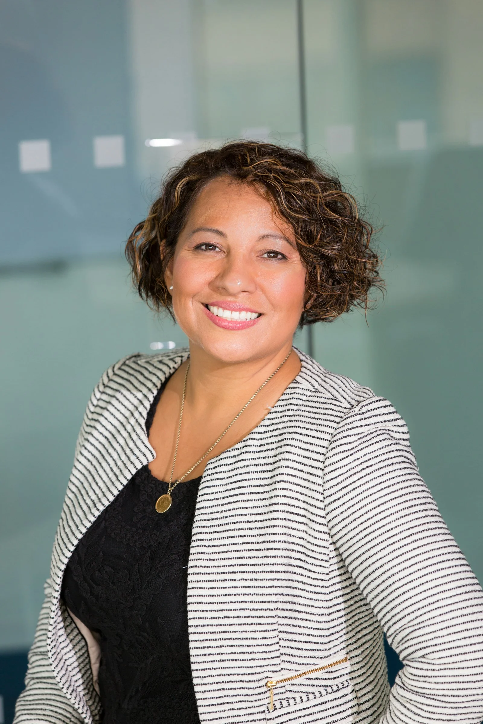 A professional portrait representing confident, accessible leadership